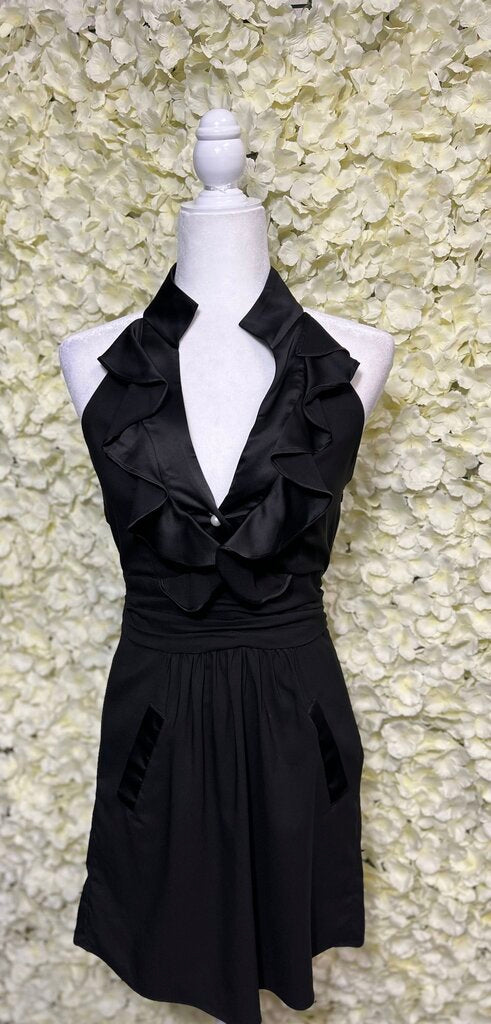 black sleeveless mini dress with ruffles and pearl detailing on neck